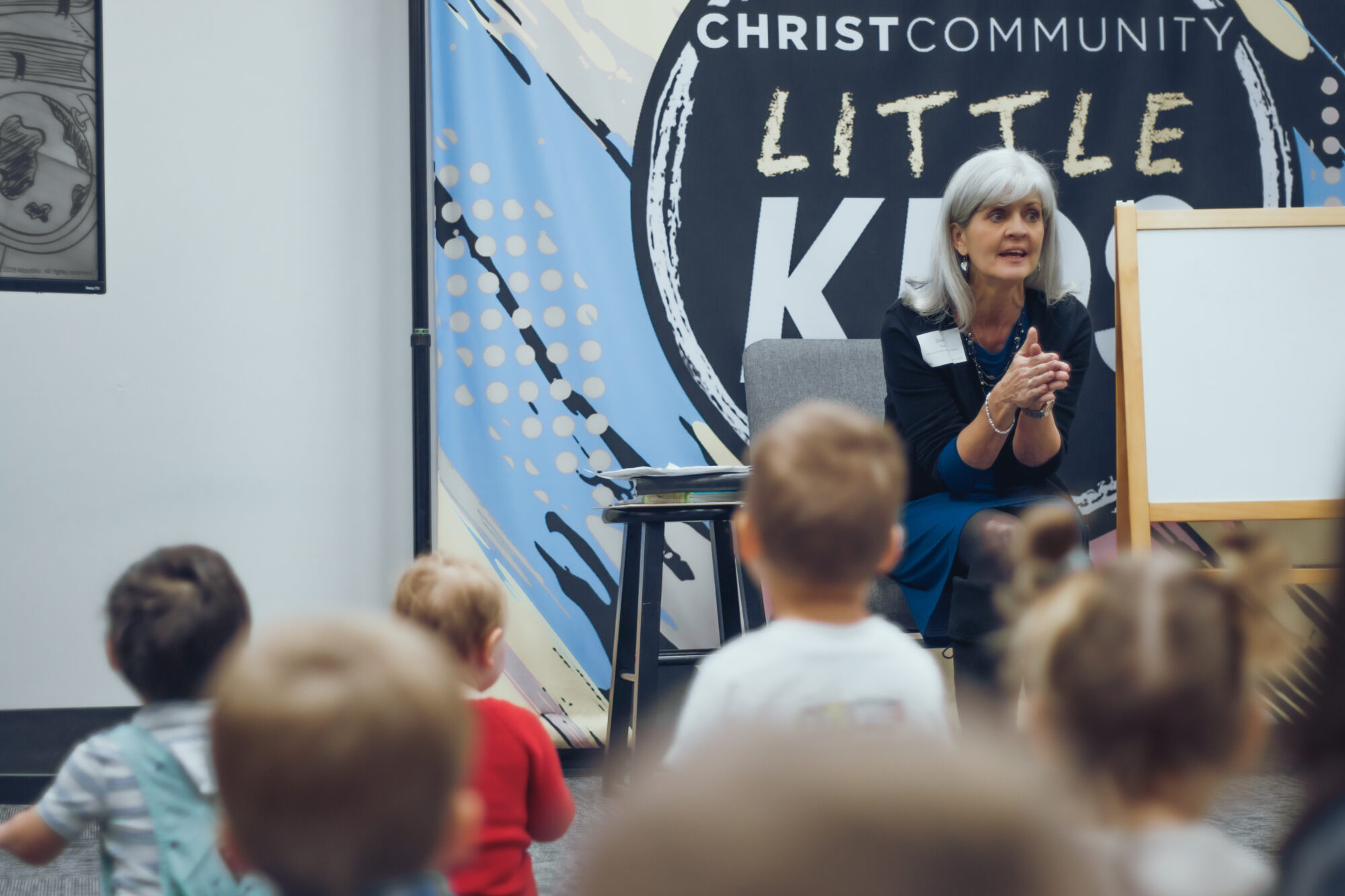 Woman Teaching Kids at Christ Community